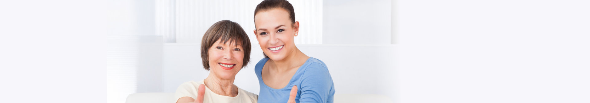 caregiver and patient showing thumbs up