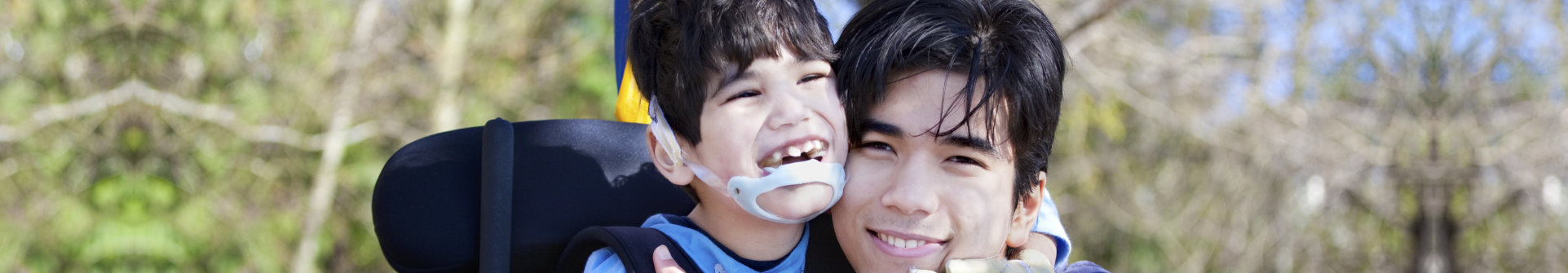 a young boy and man smiling